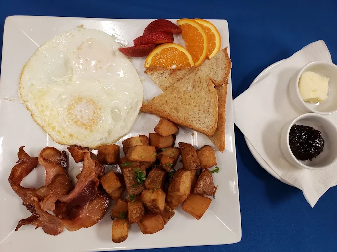 Bistro breakfast with eggs, bacon, hash browns and toast