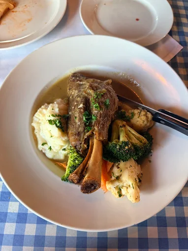 Lamb shank with potatoes and vegetables